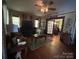 Spacious living room with wood floors, ceiling fan and front door with glass panels at 829 Green St, Salisbury, NC 28144