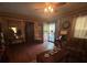 Inviting living room featuring a ceiling fan, rich woodwork, and plenty of natural light at 829 Green St, Salisbury, NC 28144