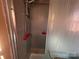 Shower stall with tile, shower head, and safety handles at 829 Green St, Salisbury, NC 28144
