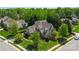 Aerial view of home showcasing mature trees, lush landscaping and beautiful curb appeal at 9200 Kingsmead Ln, Waxhaw, NC 28173