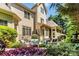 Beautiful backyard space featuring a patio, lush landscaping, and elegant architecture at 9200 Kingsmead Ln, Waxhaw, NC 28173
