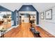 Large flex room with hardwood floors, custom woodworking, and ample space for workout equipment or other activities at 9200 Kingsmead Ln, Waxhaw, NC 28173