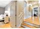 Hallway view that showcases hardwood floors, wainscoting, and access to an adjacent bedroom at 9200 Kingsmead Ln, Waxhaw, NC 28173