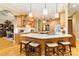 Spacious kitchen featuring a central island with bar seating, stainless steel appliances, and custom cabinetry at 9200 Kingsmead Ln, Waxhaw, NC 28173