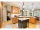 Gourmet kitchen with granite countertops, stainless steel appliances, and custom cabinets at 9200 Kingsmead Ln, Waxhaw, NC 28173