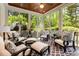 Inviting sunroom featuring comfortable seating and views of lush greenery at 9200 Kingsmead Ln, Waxhaw, NC 28173