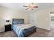 Bedroom featuring neutral color palette, a ceiling fan, and natural light at 9715 Aragorn Nw Ln, Charlotte, NC 28269