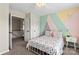 Cozy bedroom featuring stylish geometric wall design and a comfortable bed at 9715 Aragorn Nw Ln, Charlotte, NC 28269