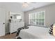 Inviting bedroom with carpet floors, a large window, and ample space for relaxation at 9715 Aragorn Nw Ln, Charlotte, NC 28269