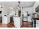 Bright kitchen featuring white cabinets, stainless steel appliances, and center island at 9715 Aragorn Nw Ln, Charlotte, NC 28269