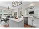 Bright kitchen with white cabinets, stainless steel appliances, and a breakfast bar at 9715 Aragorn Nw Ln, Charlotte, NC 28269