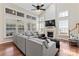 Bright living room featuring a fireplace, vaulted ceilings and an oversized sectional sofa at 9715 Aragorn Nw Ln, Charlotte, NC 28269