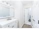 Bathroom features a white vanity with new fixtures, and another stylish bathroom through doorway at 103 Carriage House Dr, Kannapolis, NC 28081