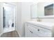Bathroom featuring a white vanity with new fixtures and marble tile in adjacent toilet room at 103 Carriage House Dr, Kannapolis, NC 28081