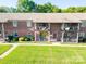 A beautiful exterior of a brick apartment complex with well-maintained landscaping and inviting balconies for relaxation at 103 Carriage House Dr, Kannapolis, NC 28081
