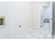 Clean, bright laundry room with connections, ample space, and marble tile floor at 103 Carriage House Dr, Kannapolis, NC 28081