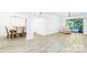 Spacious living and dining area with hardwood floors, modern lighting, and a sliding glass door opening to a balcony at 103 Carriage House Dr, Kannapolis, NC 28081