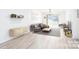 Bright and airy living room featuring stylish furnishings, modern flooring, and a sliding door for abundant natural light at 103 Carriage House Dr, Kannapolis, NC 28081