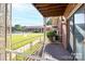 Serene outdoor porch with decorative iron railings, offering a relaxing view of the well-manicured lawns and inviting atmosphere at 103 Carriage House Dr, Kannapolis, NC 28081