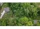 An aerial view of a charming home nestled among lush green trees in a serene and private setting at 10340 Williams Rd, Mint Hill, NC 28227