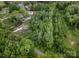 A nice aerial view of a neighborhood including houses with swimming pools nestled among abundant mature trees at 10340 Williams Rd, Mint Hill, NC 28227