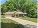 Charming home with a well-manicured lawn, attached two-car garage and a cozy screened in porch at 10340 Williams Rd, Mint Hill, NC 28227