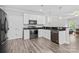 Well-equipped kitchen with white cabinets, stainless steel appliances, and a convenient breakfast bar at 10340 Williams Rd, Mint Hill, NC 28227