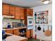 Charming kitchen with wooden cabinets, modern appliances, and open shelving for spices at 1042 Jackson Rd, Fort Lawn, SC 29714