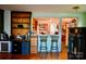 Eat in kitchen with built in shelving, bar seating, and hardwood flooring at 1042 Jackson Rd, Fort Lawn, SC 29714