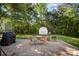 Landscaped backyard with a shed, patio, mature trees, and a well-maintained lawn at 106 Friendfield Dr # B, Fort Mill, SC 29715