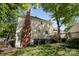 Large backyard with a chimney, deck, mature trees, and a well-manicured lawn at 106 Friendfield Dr # B, Fort Mill, SC 29715