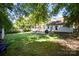 Lush backyard featuring a deck, patio, mature trees and a well-maintained lawn at 106 Friendfield Dr # B, Fort Mill, SC 29715