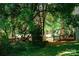 Private backyard with a wooden gate surrounded by lush greenery and mature trees at 106 Friendfield Dr # B, Fort Mill, SC 29715
