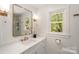 Bright bathroom with white vanity, quartz counters, gold fixtures, and natural light at 106 Friendfield Dr # B, Fort Mill, SC 29715