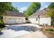 Long driveway with a two-car garage and a basketball hoop in the backyard of the home at 106 Friendfield Dr # B, Fort Mill, SC 29715