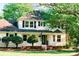 Inviting two-story home with manicured lawn, beautiful landscaping, and charming front porch at 106 Friendfield Dr # B, Fort Mill, SC 29715