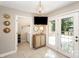 Bright hallway features a beaded chandelier, cabinet, exterior access, and doorway to laundry area at 106 Friendfield Dr # B, Fort Mill, SC 29715