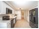 Open kitchen with black appliances and white cabinets create a bright and welcoming space at 106 Friendfield Dr # B, Fort Mill, SC 29715
