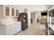 Spacious kitchen with white cabinets, tiled flooring, and modern black appliances at 106 Friendfield Dr # B, Fort Mill, SC 29715