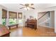 Bright and airy living room featuring hardwood floors, a large bay window, and a piano at 106 Friendfield Dr # B, Fort Mill, SC 29715