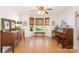Cozy room featuring wood floors, grand piano, natural light, and stylish furnishings at 106 Friendfield Dr # B, Fort Mill, SC 29715