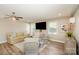 Cozy living room with ceiling fan, stylish decor, and large windows allowing ample natural light at 106 Friendfield Dr # B, Fort Mill, SC 29715