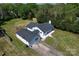 An aerial view of a charming home, highlighting its spacious yard and proximity to lush green trees at 1081 Deas St, Rock Hill, SC 29732