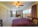 Bright bedroom featuring a comfortable bed, purple curtains, and soft carpet, exuding a relaxing atmosphere at 1081 Deas St, Rock Hill, SC 29732
