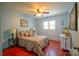 Comfortable bedroom with a ceiling fan and matching bedside lamps at 1081 Deas St, Rock Hill, SC 29732