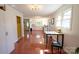 Open kitchen featuring a table and seating area, white cabinets, and original tile floors at 1081 Deas St, Rock Hill, SC 29732