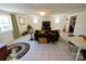 Inviting living room with tile flooring, neutral walls, and comfortable seating arrangement at 1081 Deas St, Rock Hill, SC 29732