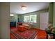 Cozy living room with fireplace, hardwood floors, and bright natural light from the windows at 1081 Deas St, Rock Hill, SC 29732