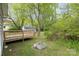 Enjoy outdoor living on this deck with mature trees, a shed, and green spaces perfect for recreation at 1119 Highway 218 W Hwy, Indian Trail, NC 28079