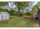 Backyard features a large shed, a swing set, firepit and a wooden deck great for relaxing and entertaining at 1119 Highway 218 W Hwy, Indian Trail, NC 28079